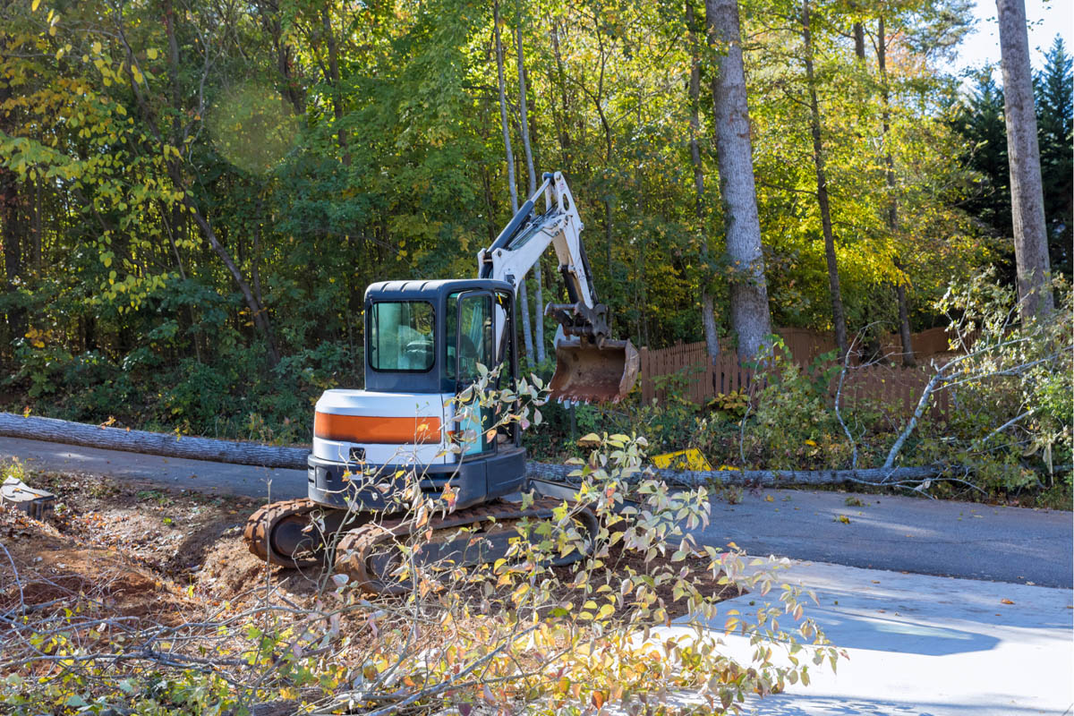 An excavator is clearing a road.